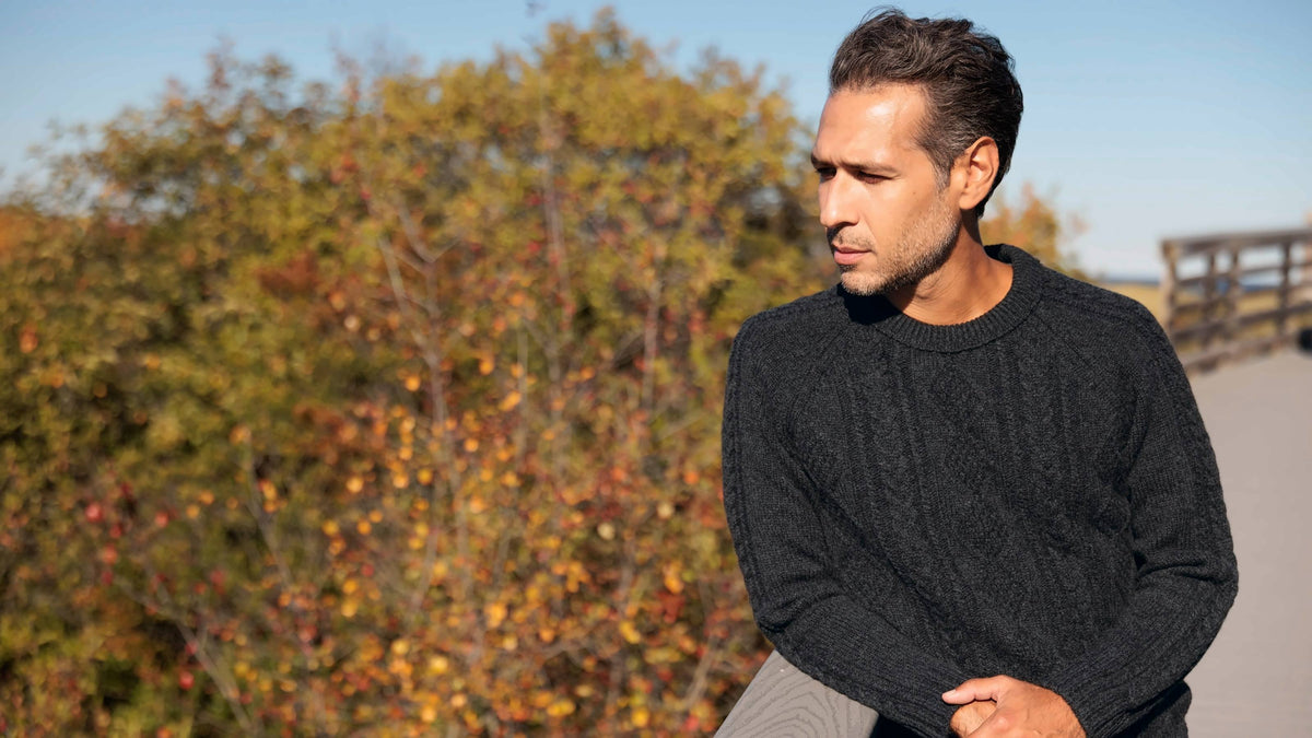 The Ross 4-ply Scottish lambswool cable knit crewneck in Charcoal, lifestyle