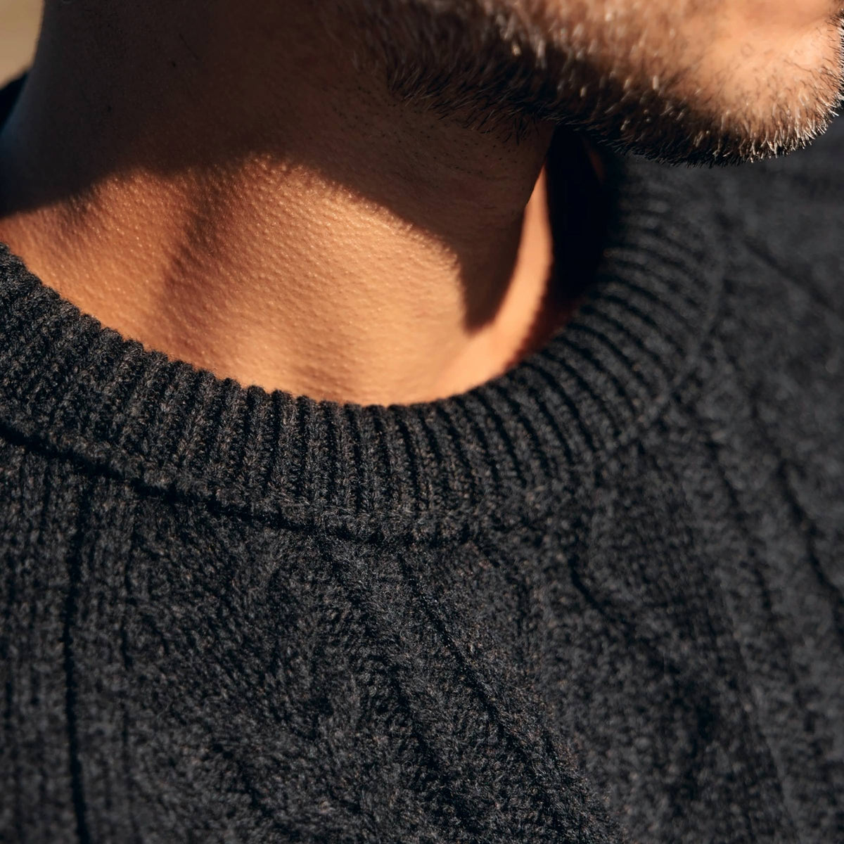 The Ross 4-ply Scottish lambswool cable knit crewneck in Charcoal, neckline and saddle shoulder detail