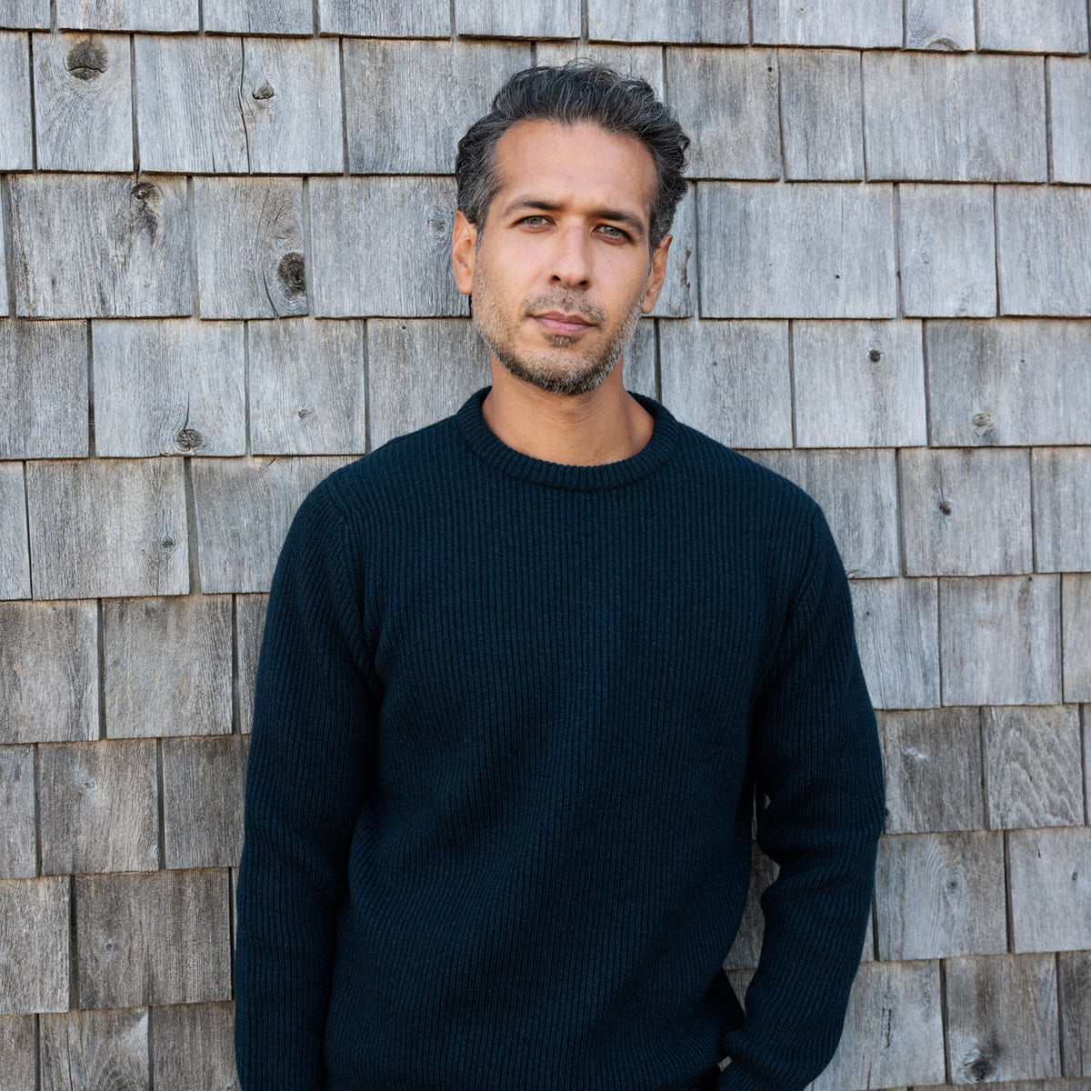 The Finlay 4-ply Scottish cashmere ribbed crewneck in Midnight, front view, hands in pockets
