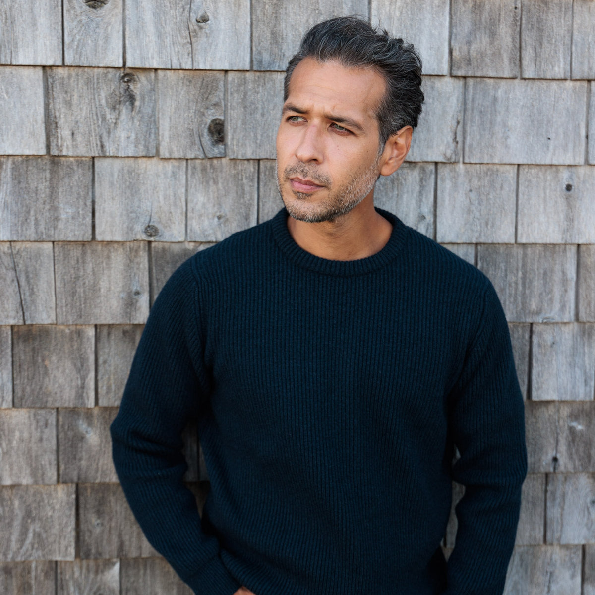 The Finlay 4-ply Scottish cashmere ribbed crewneck in Midnight, three-quarter view showing the sleeve rib